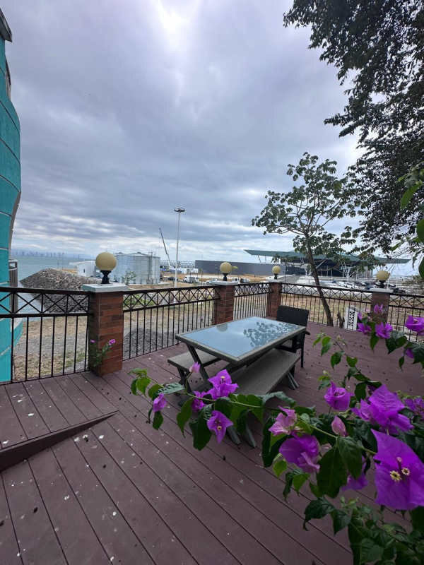 Bedroom featuring balcony door, city view and stylish decor in Pacific Bay Residences Amador