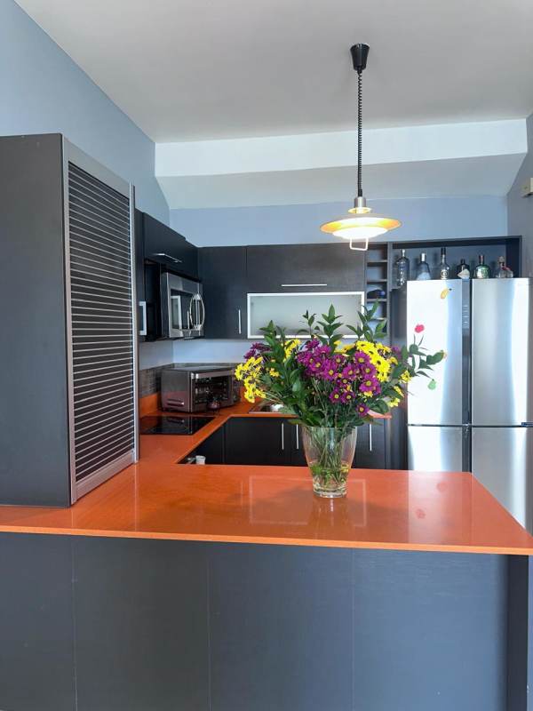 Modern living room with ocean view windows, ceramic floors and open layout in Amador Panama