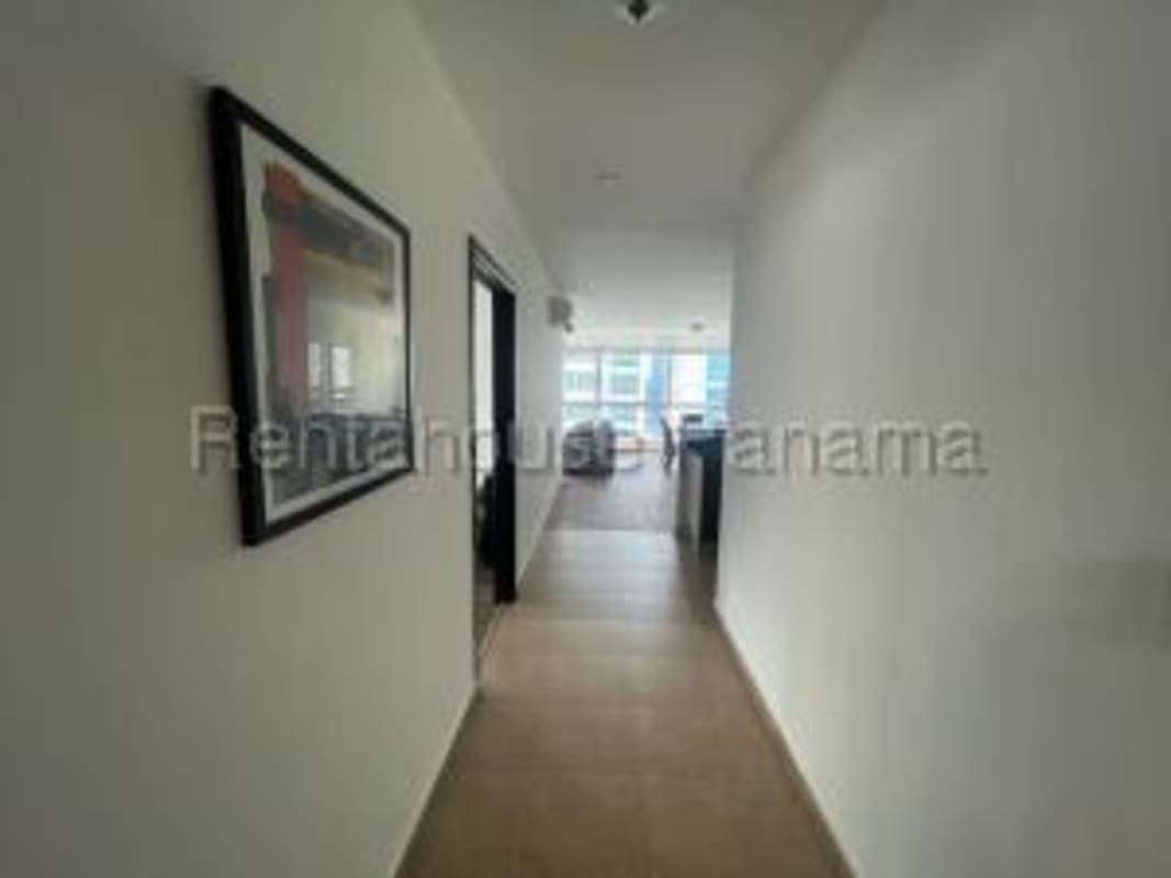 Bright hallway leading to living area with tiled floors and modern lighting PH Bayfront Panama