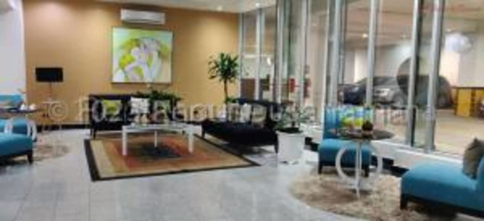 Contemporary lobby reception area with sofas and glass partition at PH Bayfront Avenida Balboa