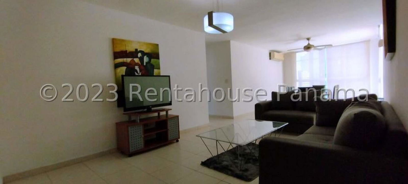 Large living and dining area with terrace access, porcelain floors in Punta Pacifica rental apartment