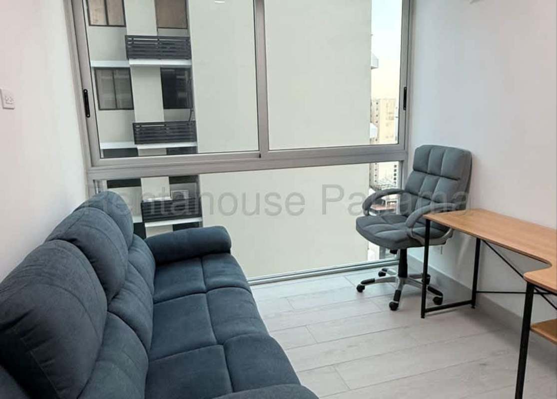 Open-concept kitchen with breakfast bar, dining area, large windows with city skyline views in PH Obarrio Panama