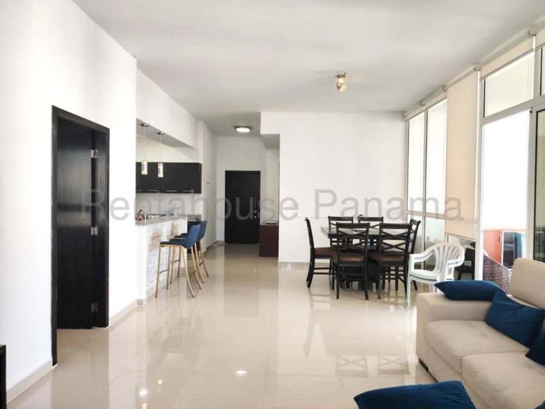 Modern master bedroom with floor-to-ceiling windows, ocean and city view, upscale furniture at PH Quadrat