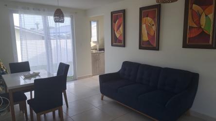 Open living dining space with window tile floors rental house Playa Dorada Arraiján Panama