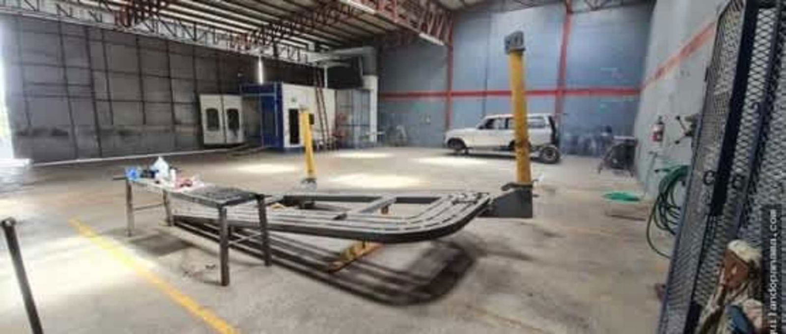 Warehouse with mezzanine offices, concrete flooring and industrial lighting Panama City