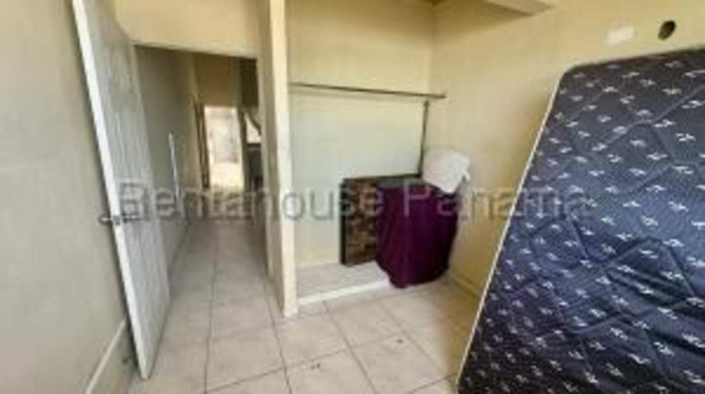 Outdoor playground play structure swings inside gated community Residencial Llano Bonito Panama City