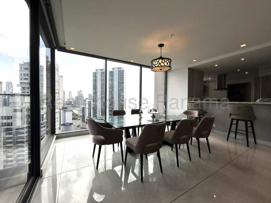 Modern kitchen with granite counters island gas stove built-in cabinets in Panama City oceanfront condo