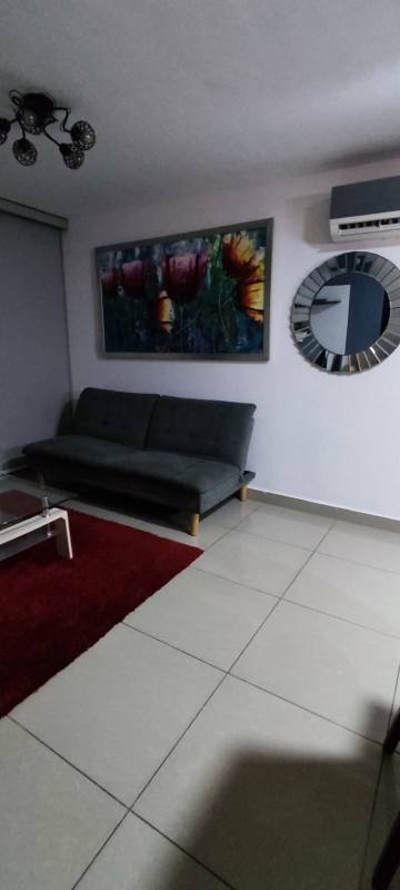 Open dining area connected to living room with furniture in PH Coral Tower Panama