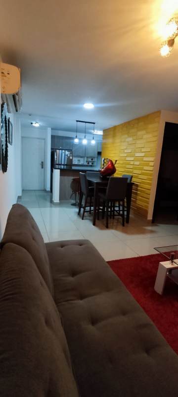 Equipped kitchen with granite countertops, wood cabinets, appliances at PH Coral Tower Carrasquilla Panama City
