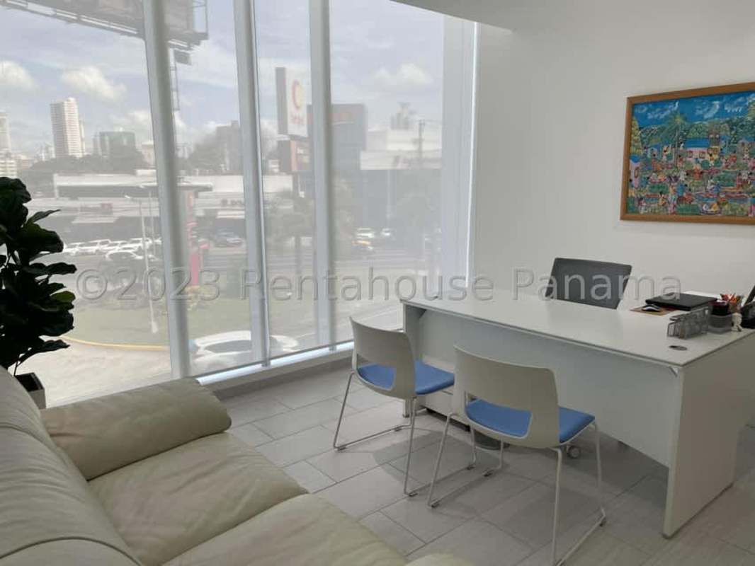 Modern reception area with glass partitions, tiled flooring, white furnishings in Financial Park Tower San Francisco Panama