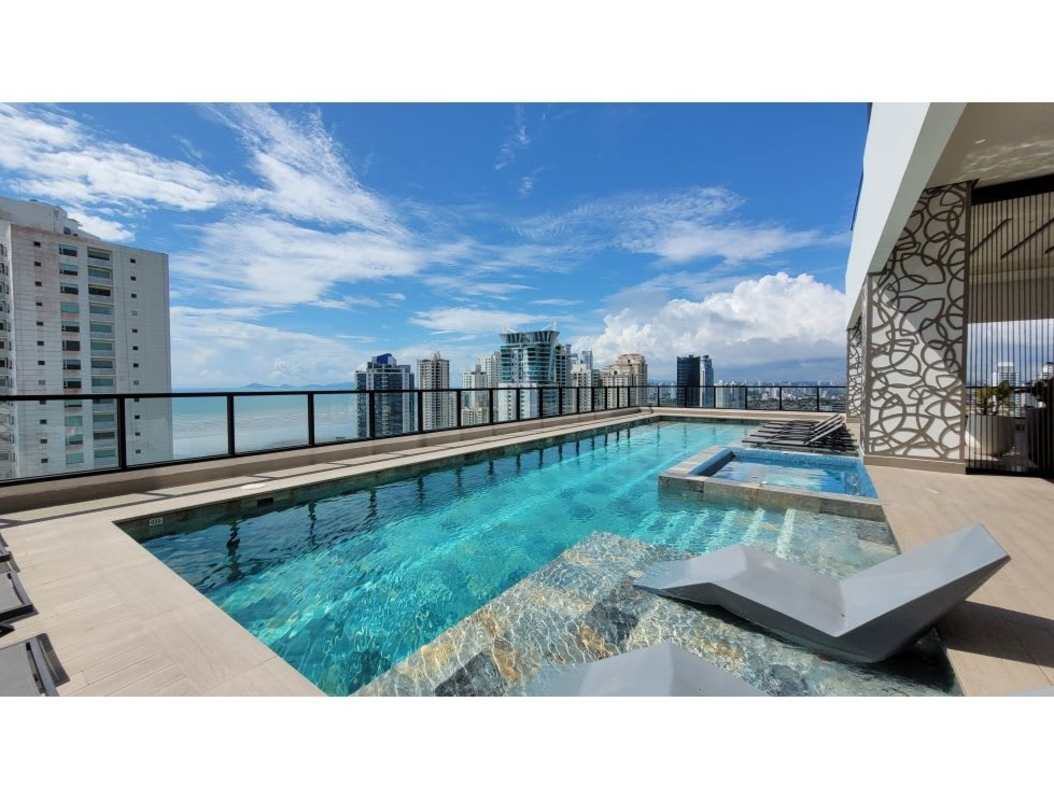 Luxury rooftop swimming pool overlooking ocean and Costa del Este skyline in Panama City