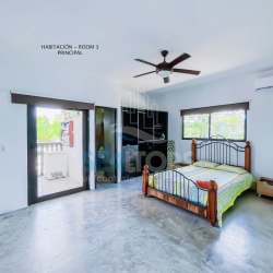 Spacious master bedroom with AC, large windows, door to terrace Costa Esmeralda Panama