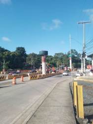 Pan-American Highway construction of Metro overpass with concrete pillars near retail center Arraiján Panama