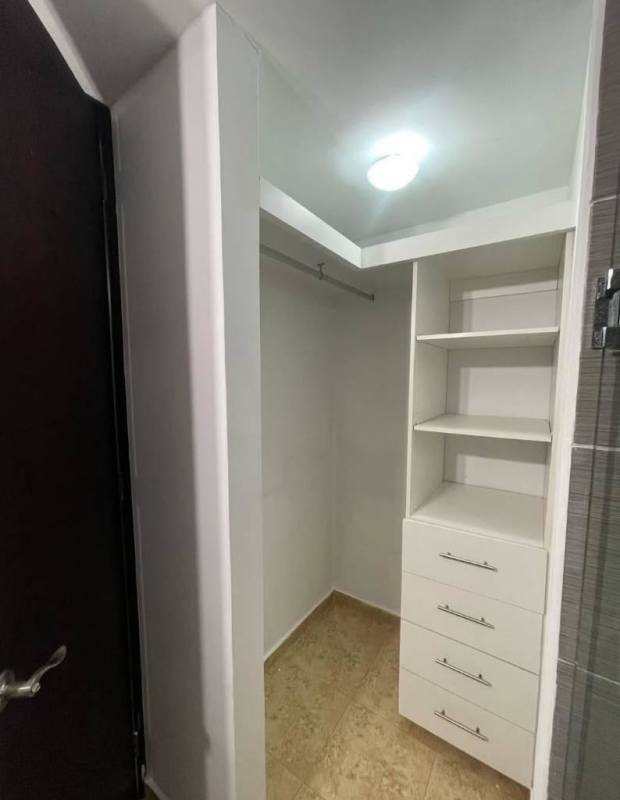 Empty bedroom with built-in wardrobe, tile flooring and AC PH Cosmopolitan Tower Panama
