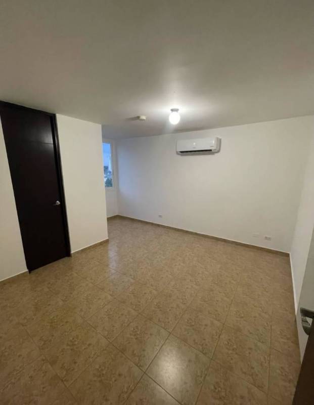 Bright bedroom with tile floor, modern AC, and window in PH Cosmopolitan Tower Panama
