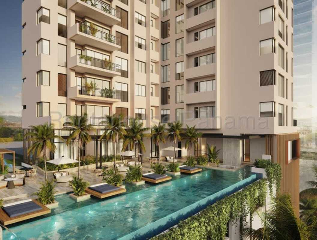 Bright open-concept living-dining space with marble floors and views