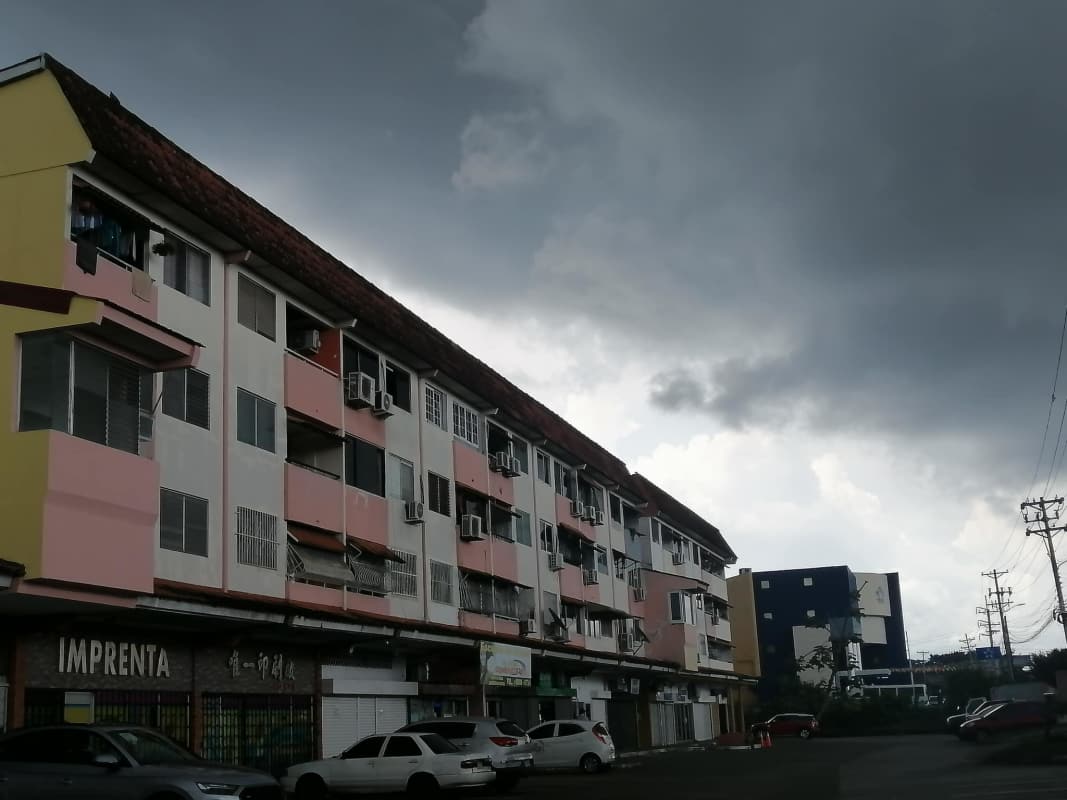 Facade of PH Residencial Los Alamos with commercial and residential areas Panama City