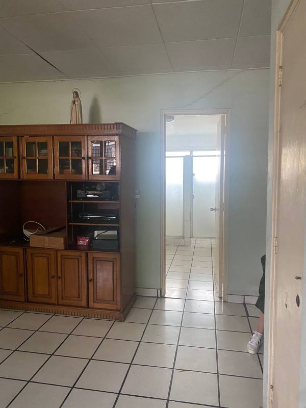 Bright living room with French doors, tiled floor, ceiling fans luxury family house San Francisco Panama