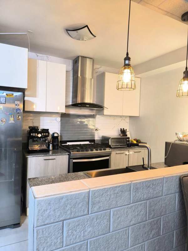 Bright open living dining area with ceramic floors balcony PH Metropolitan Park Panama City