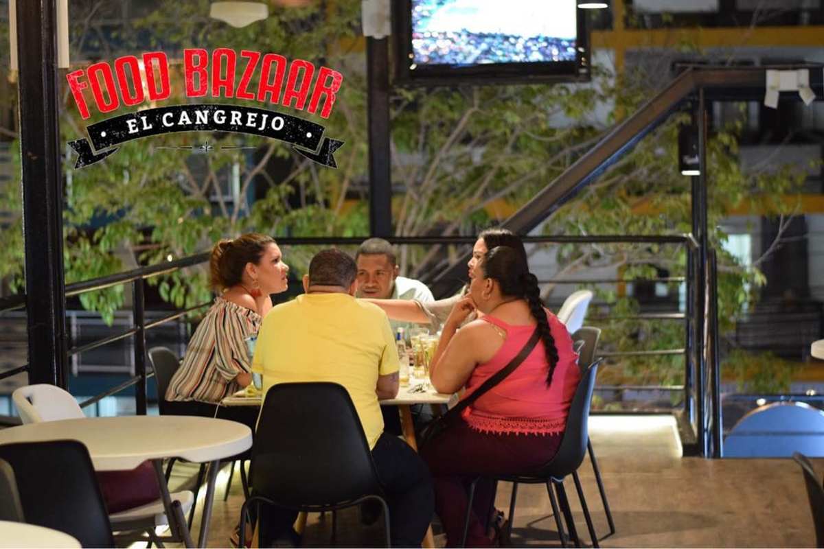 Restaurant balcony seating area overlooking street in Food Bazaar Plaza El Cangrejo Panama City
