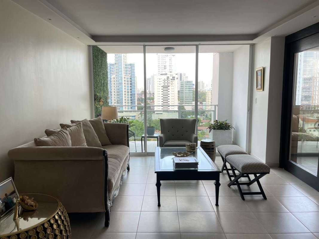 Living dining area with balcony access large windows city skyline PH San Francisco Bay Panama
