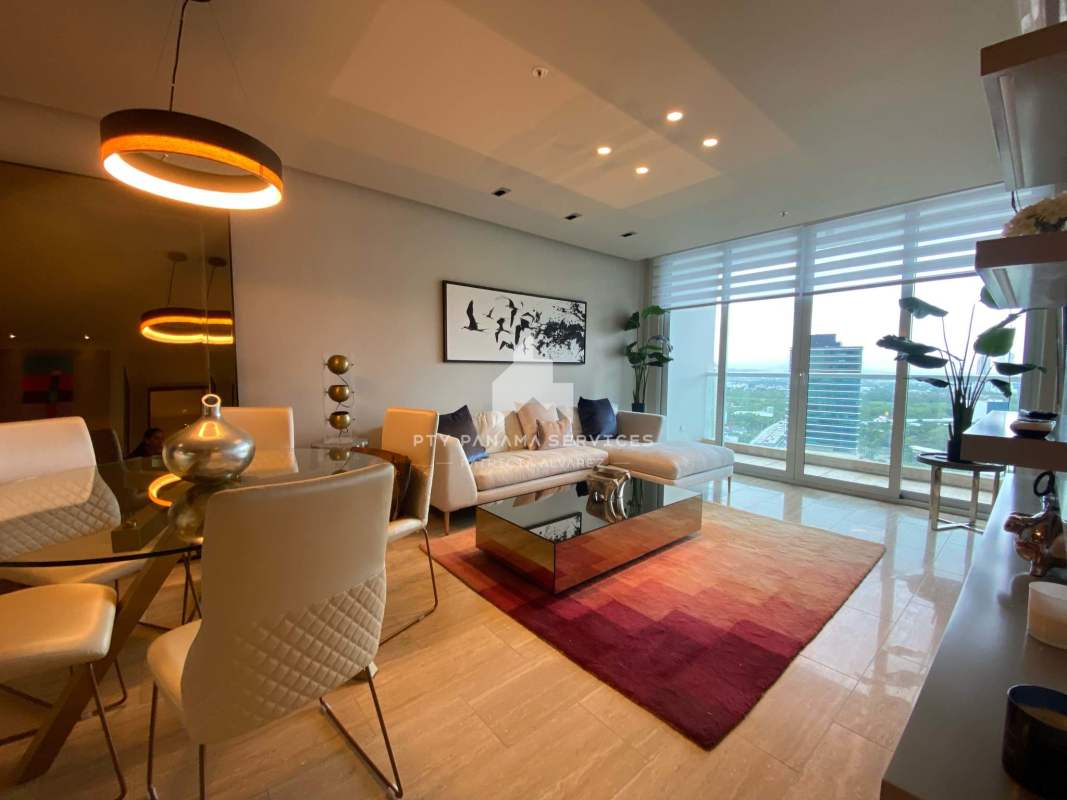 Modern open kitchen with stainless appliances and marble counters in PH Costa del Este Panama