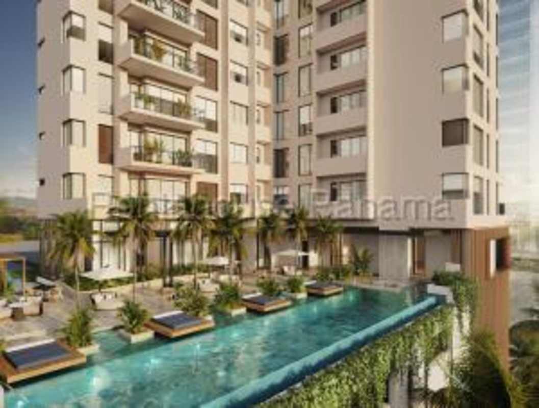 Roof-top infinity pool with lounge chairs and palm trees PH Madero Costa del Este luxury condos Panama City