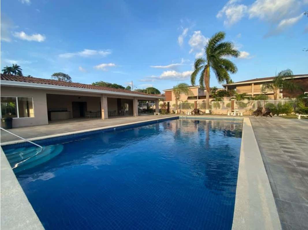 Open plan living dining area with windows and ceiling fans PH Villa Navona Panama