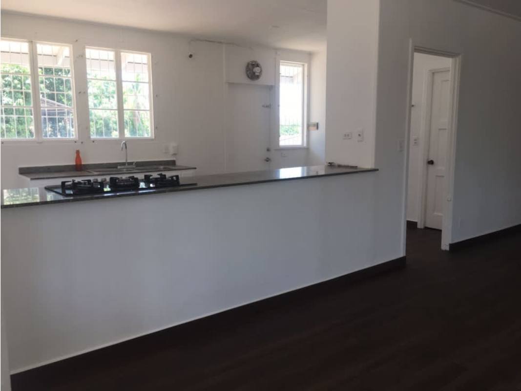 Bedroom with hardwood floors large windows garden view Los Ríos Panama City