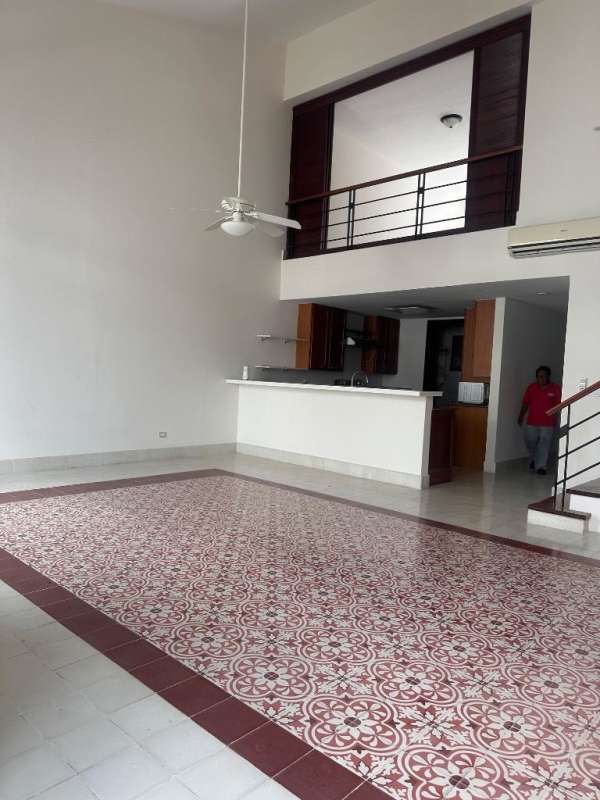 Spacious living area with loft, open kitchen, and traditional tile Casco Viejo Panama