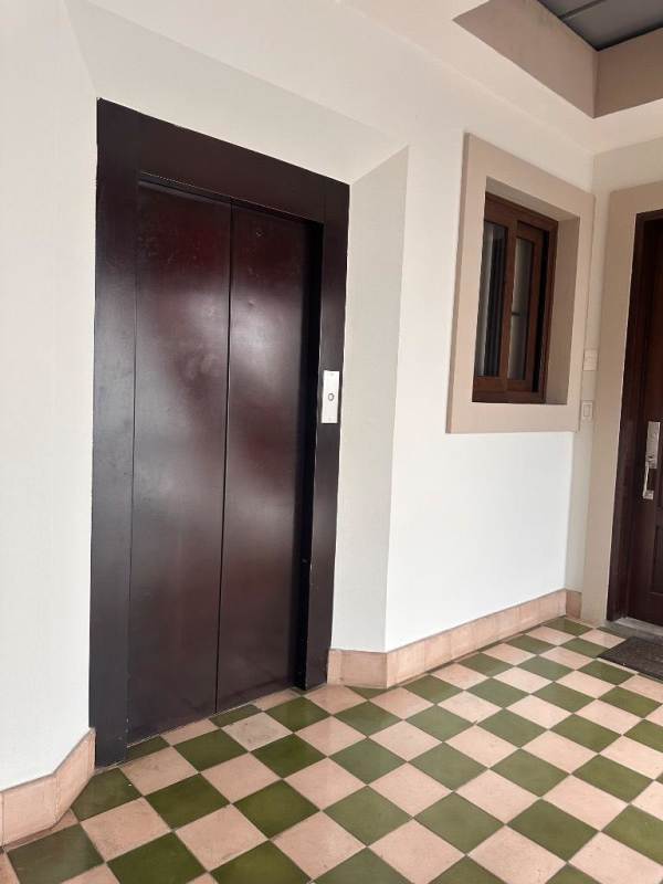 Wide corridor with modern elevator and colonial architectural touches Casco Viejo