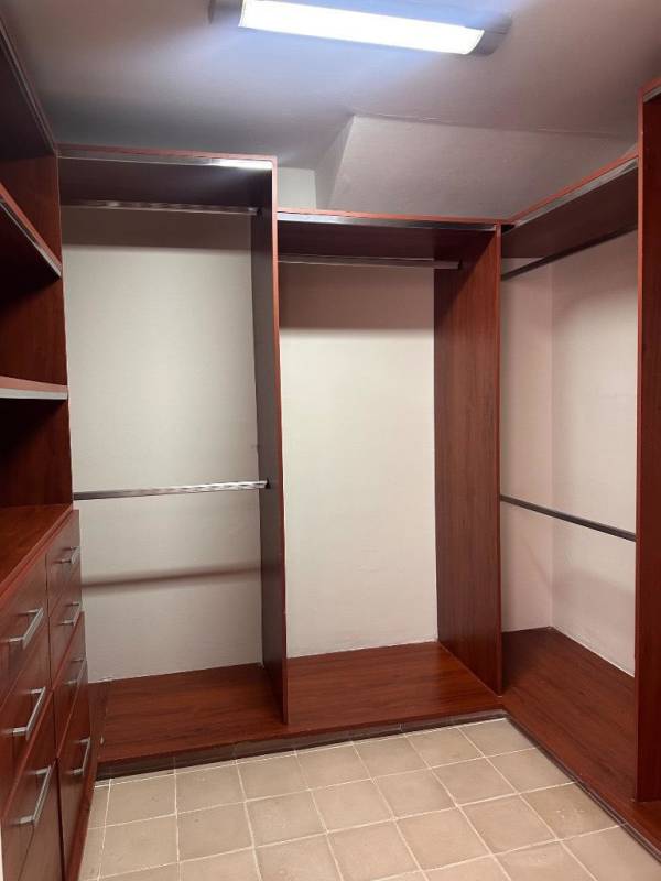 Interior hallway with traditional tile floor, wooden elevator doors Casco Viejo Panama