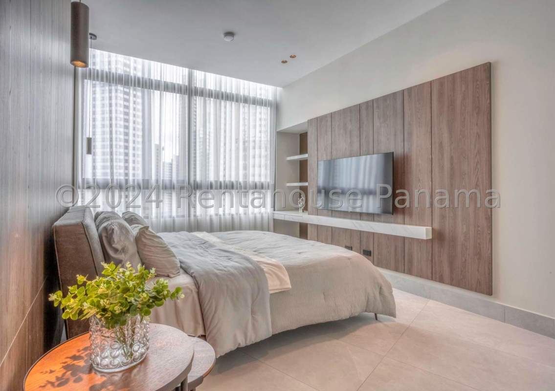 Bright living dining area with floor-to-ceiling windows PH Paitilla Residences Panama