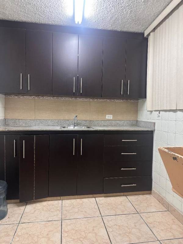 Kitchen with wood cabinets granite counters PH Vía Israel Tower Panama City