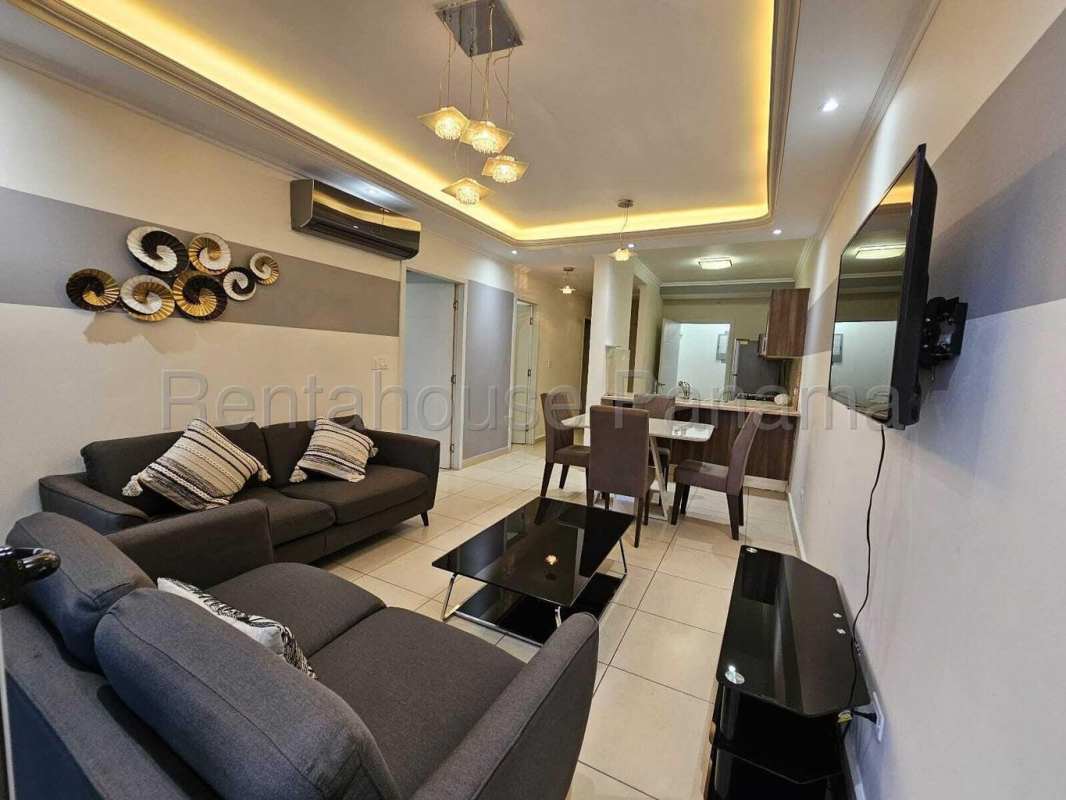 Bedroom featuring large windows with sea view at Oasis on the Bay Panama City