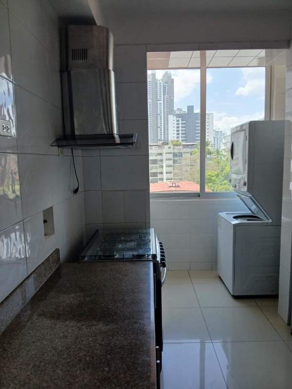 Compact kitchen with granite counter, stove, washer dryer and city view in PH El Cangrejo Plaza