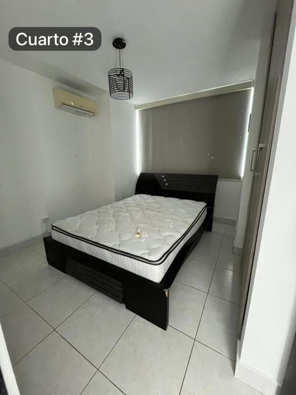 Bedroom with AC white furniture window Edison Park apartment Panama City