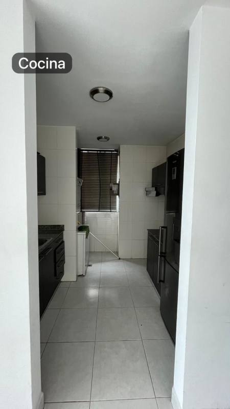 Narrow kitchen granite counters black cabinets window light Edison Park Panama