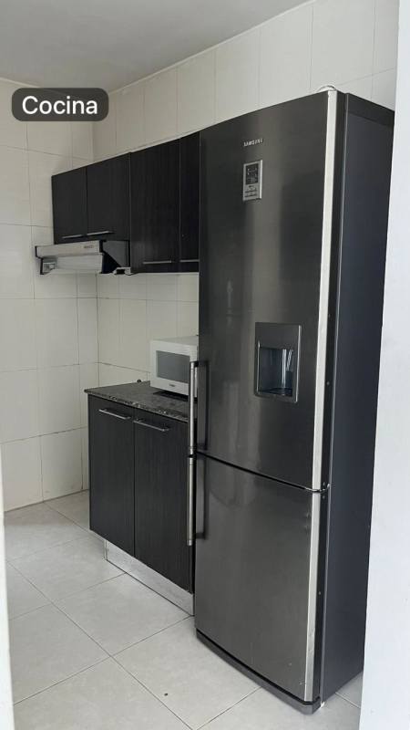 Full kitchen with appliances, tiled walls, cabinets in Edison Park apartment Panama City