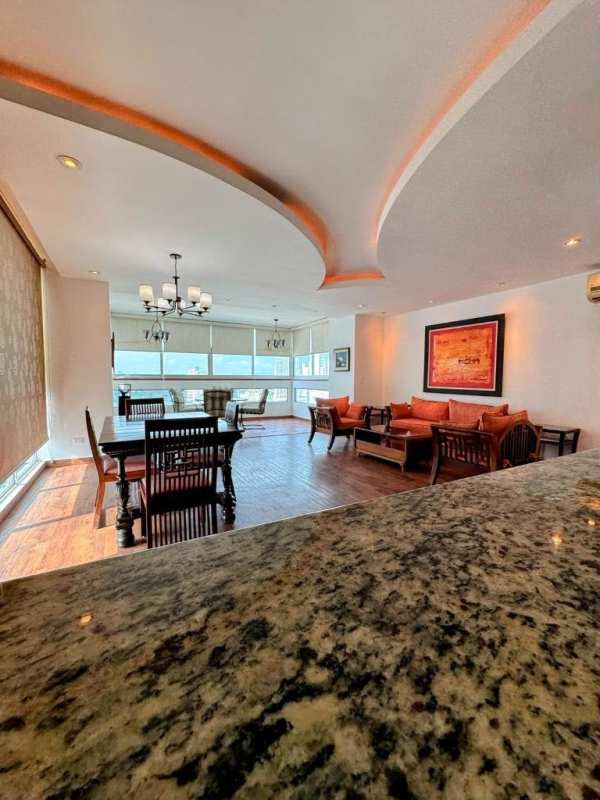 Open living dining area with large windows wood flooring balcony PH San Francisco Bay Panama