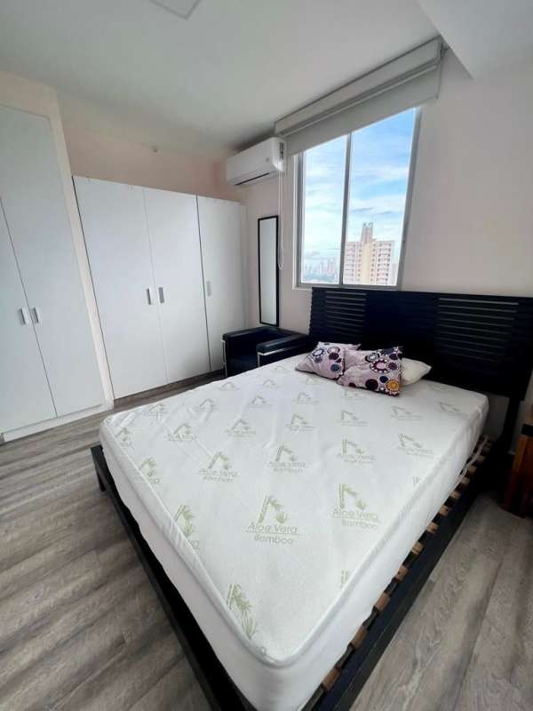 Bedroom with large window, air conditioning, and built-in closet at PH El Doral Hato Pintado Panama