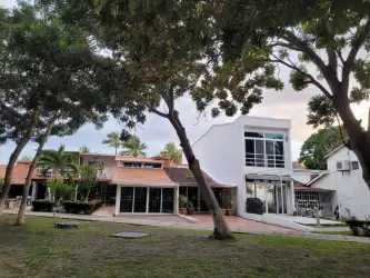 Small kitchenette with fridge, cook space, industrial exposed brick finish in studio condo at Club Bahia Panama