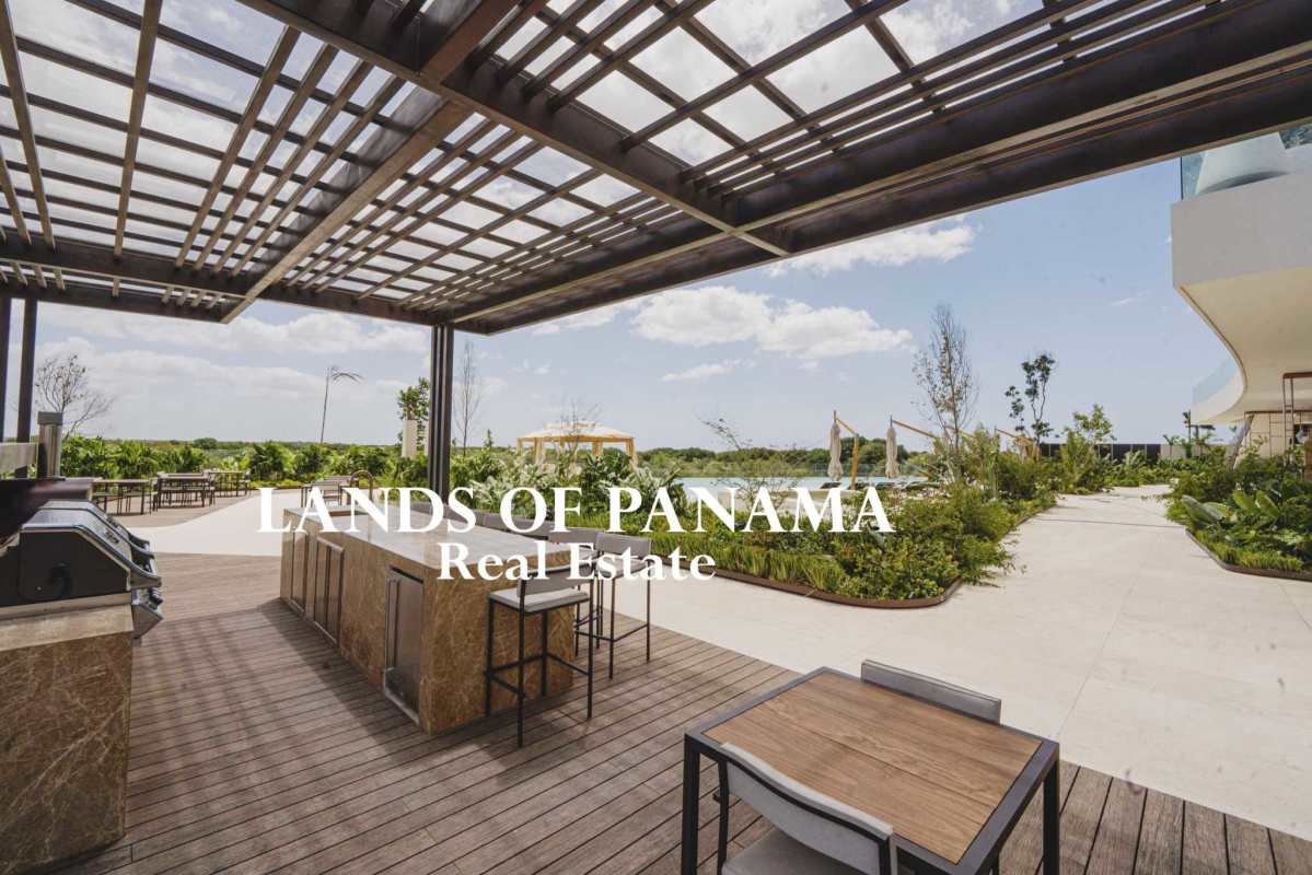 Spacious terrace with glass railings overlooking Pacific Ocean and Panama skyline in Santa María