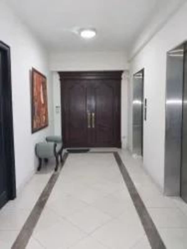 Luxury dining area with chandelier, marble flooring, and traditional decor in PH Ocean One