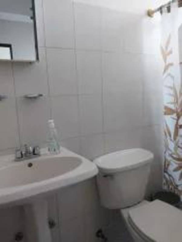 Elegant living space with panoramic ocean views, wood coffered ceiling in PH Ocean One