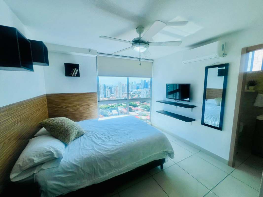 Bathroom with walk-in shower, stylish sink and wall mirror in PH Altamira Residences