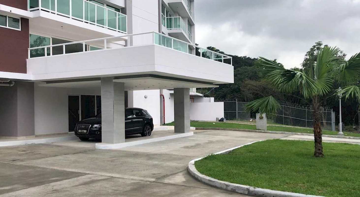 Multi-story apartment complex with balconies, parking area and landscaped gardens in Forest Gate Albrook Panama