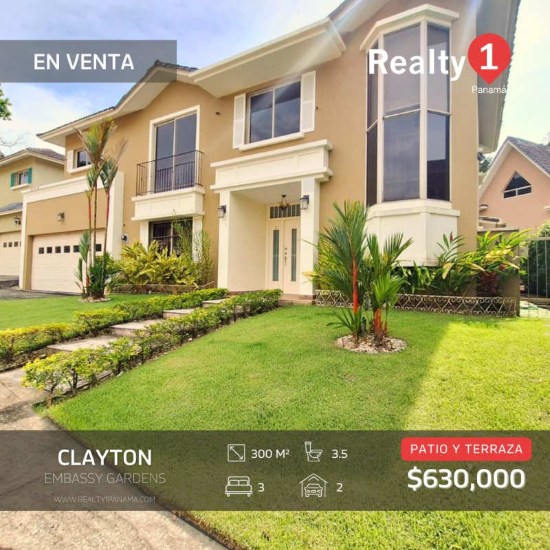Two-story contemporary house in Clayton PH Embassy Gardens with manicured front yard balcony garage