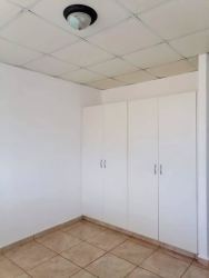 Empty bedroom with white closet and tile floor in Brisas del Golf Arraiján Panama