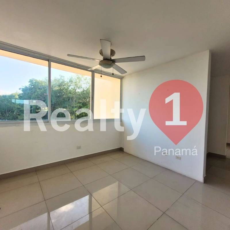 Empty bedroom with ceiling fan, tile floors, large window in apartment PH Pine Hills for sale Albrook Panama City